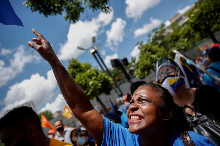 FILE PHOTO: A supporter of Venezuela's opposition leader, Juan Guaido, attends a rally during celebrations of the 210th anniversary of the independence of Venezuela, in Caracas, Venezuela, July 5, 2021. REUTERS/Leonardo Fernandez Viloria/File Photo