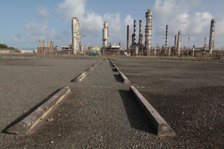 FILE PHOTO: An abandoned parking lot is seen outside the installations of the Limetree Bay  petroleum refinery in St Croix, U.S. Virgin Islands June 28, 2017. Picture taken June 28, 2017. REUTERS/Alvin Baez/File Photo