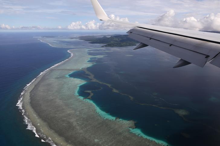 U.S. Secretary of State Mike Pompeo's plane makes its landing approach on Pohnpei International Airport in Kolonia, Federated States of Micronesia August 5, 2019. REUTERS/Jonathan Ernst