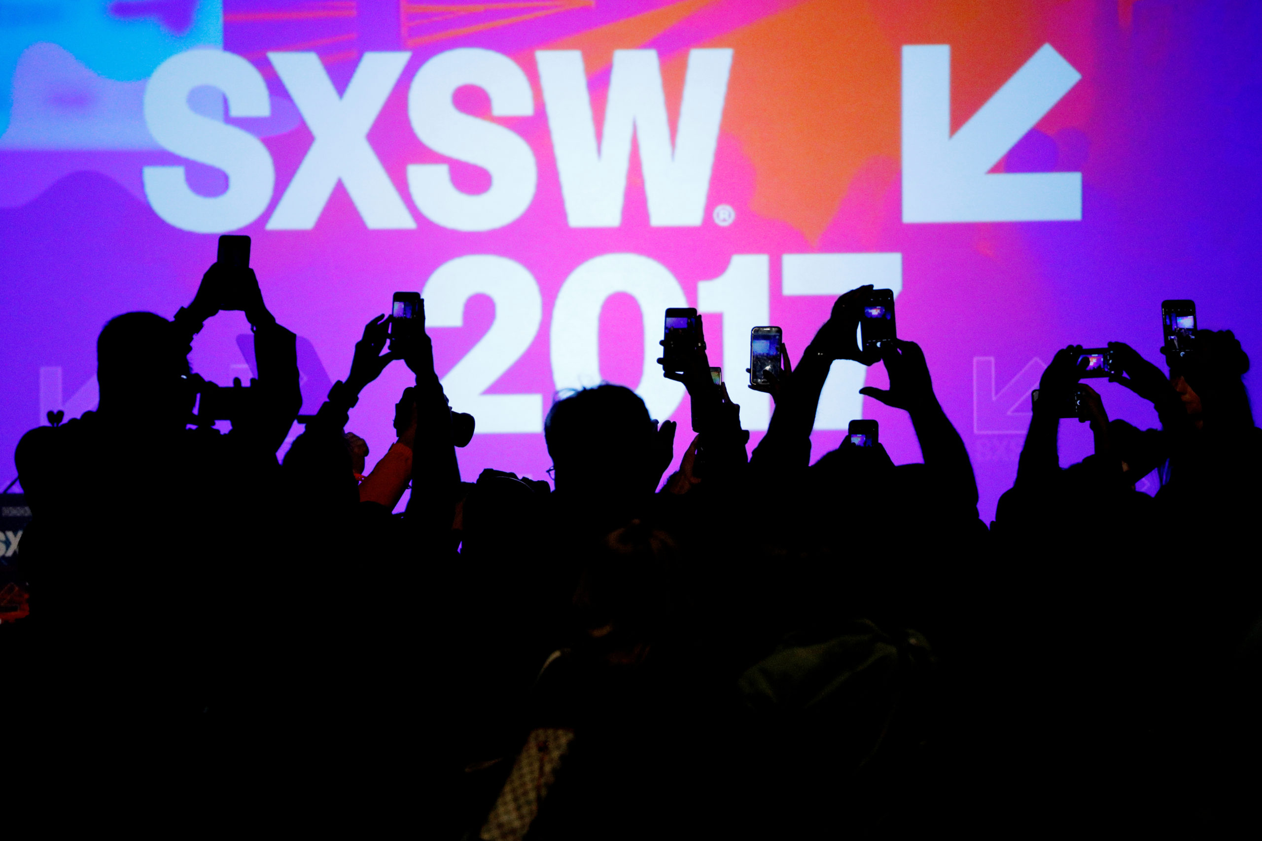 Audience members use their mobile phones to take photographs of former U.S. Vice-President Joe Biden at the South by Southwest (SXSW) Music Film Interactive Festival 2017 in Austin, Texas, U.S., March 12, 2017.   REUTERS/Brian Snyder - RC1F3E133700