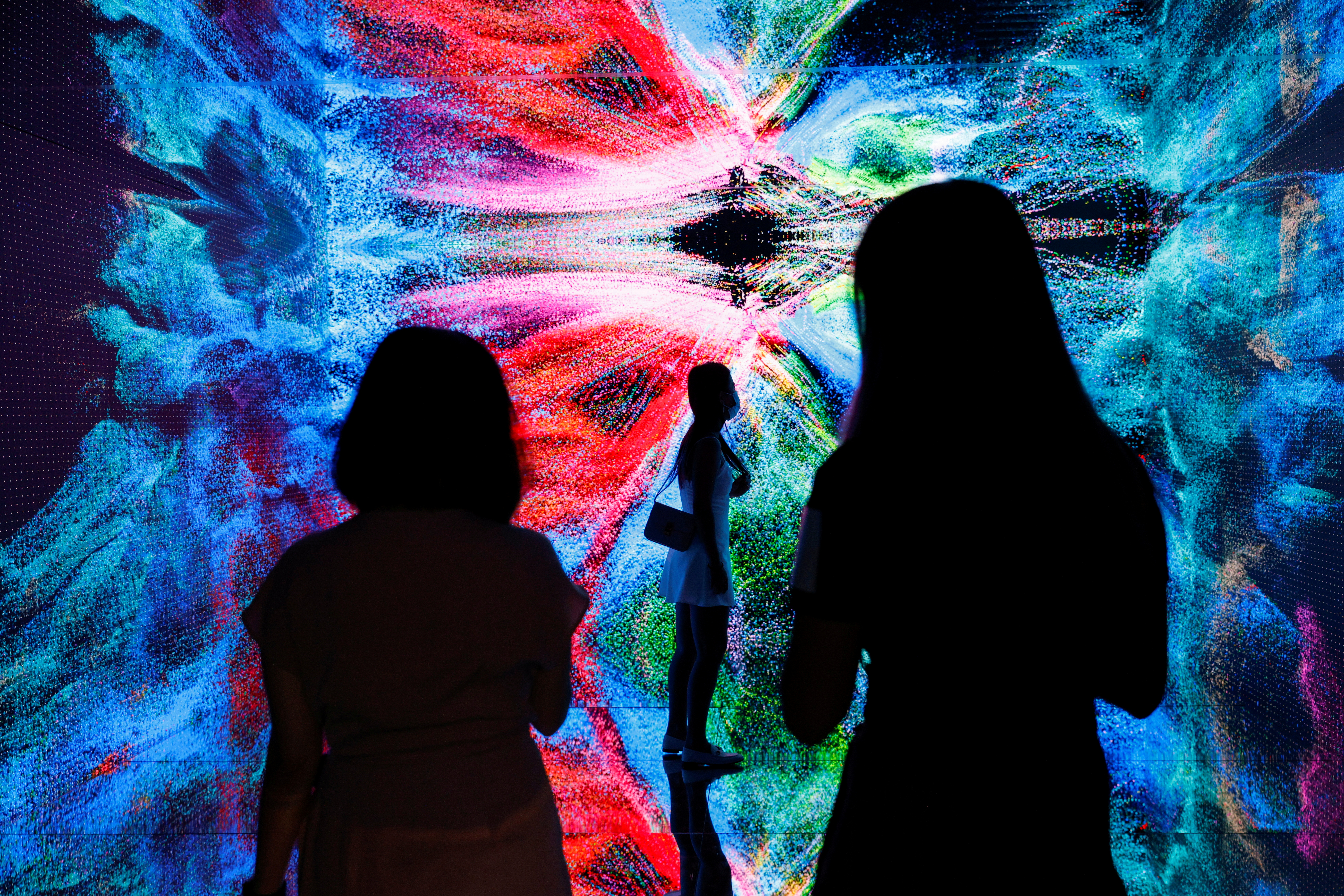 Visitors are pictured in front of an art installation which will be converted into NFT and auctioned online at Sotheby’s, in Hong Kong