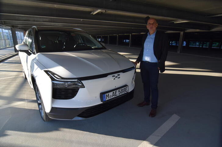 Aiways Executive Vice President Alexander Klose shows off the Chinese carmaker's electric U5 crossover SUV model that the company is selling in a growing number of European countries, in Munich, Germany, September 6, 2021. Picture taken September 6, 2021. REUTERS/Nick Carey