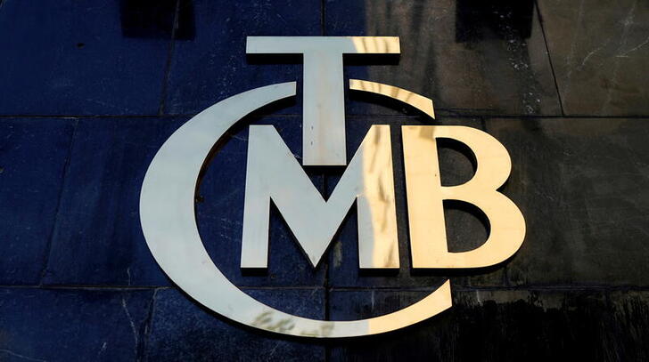FILE PHOTO: A logo of Turkey's Central Bank (TCMB) is pictured at the entrance of the bank's headquarters in Ankara, Turkey April 19, 2015. REUTERS/Umit Bektas///File Photo