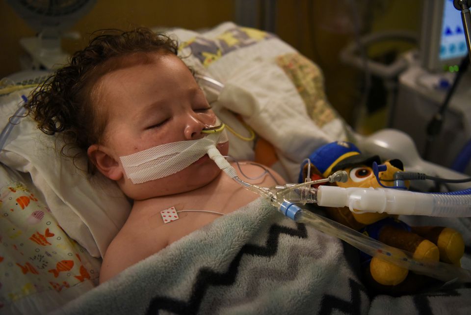 Adrian James, 2, who tested positive for the coronavirus disease (COVID-19), breathes with the help of a ventilator at SSM Health Cardinal Glennon Children's Hospital in St. Louis, Missouri, U.S., October 5, 2021. REUTERS/Callaghan O'Hare