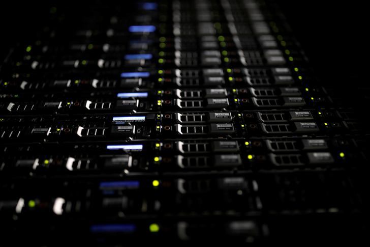 Lights illuminate rack servers inside the data center of Equinix in Pantin, outside Paris, France, December 7, 2016. REUTERS/Benoit Tessier