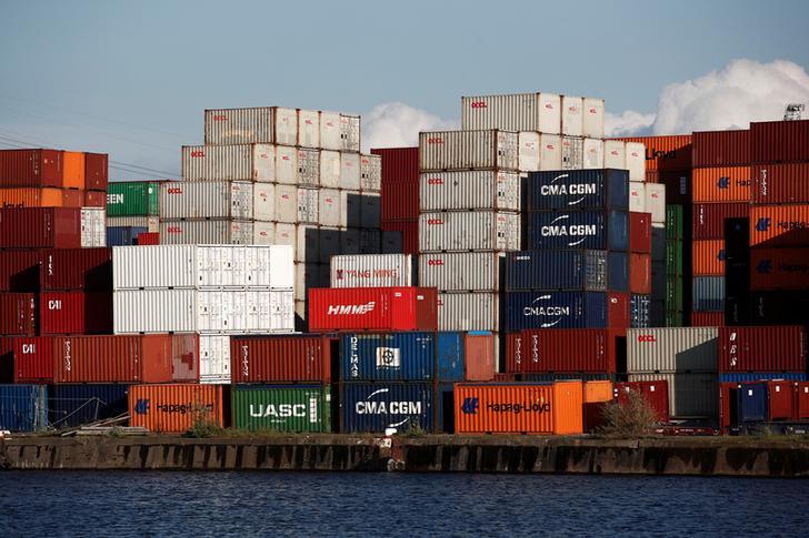 Shipping containers sit stacked in the Port of Le Havre, France, May 9, 2019. REUTERS/Benoit Tessier