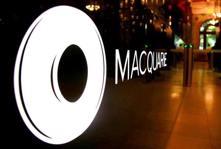 FILE PHOTO: The logo of Australia's biggest investment bank Macquarie Group Ltd adorns a desk in the reception area of its Sydney office headquarters in Australia, Oct. 28, 2016. REUTERS/David Gray/File Photo/File Photo/File Photo