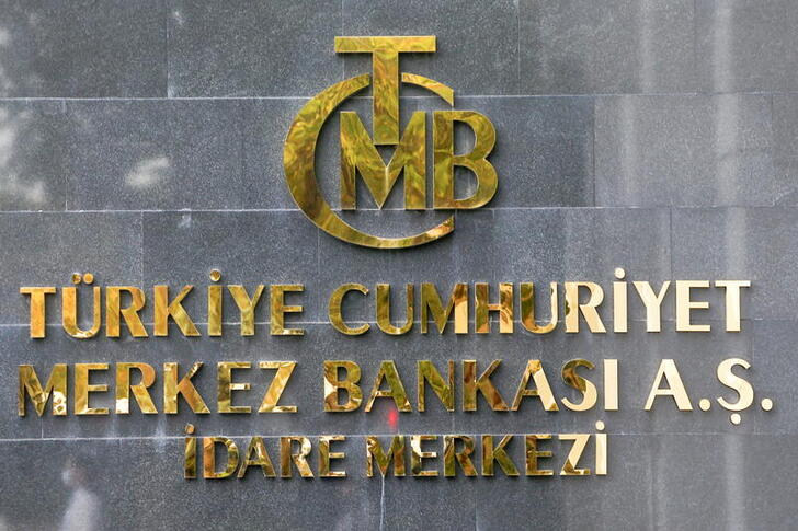 FILE PHOTO: FILE PHOTO: A logo of Turkey's Central Bank is pictured at the entrance of its headquarters in Ankara, Turkey October 15, 2021. REUTERS/Cagla Gurdogan/File Photo/File Photo