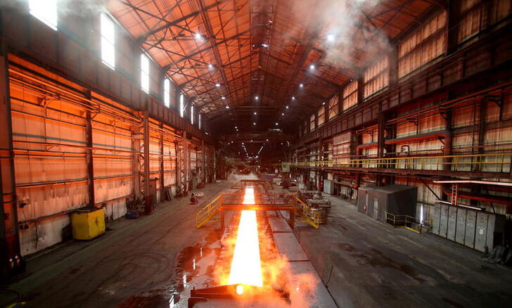 FILE PHOTO: Steam rolls off a slab of steel as it rolls down the line at the Novolipetsk Steel PAO steel mill in Farrell, Pennsylvania, U.S., March 9, 2018. REUTERS/Aaron Josefczyk/File Photo