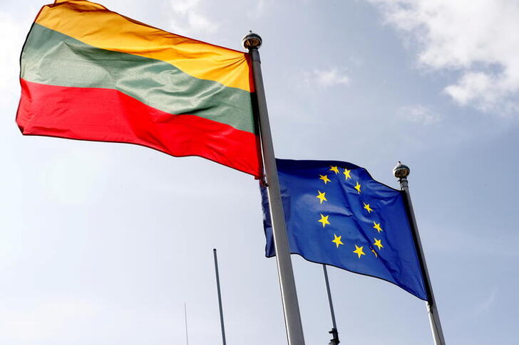 FILE PHOTO: European Union and Lithuanian flags flutter at border crossing point in Medininkai, Lithuania September 18, 2020. REUTERS/Ints Kalnins/File Photo