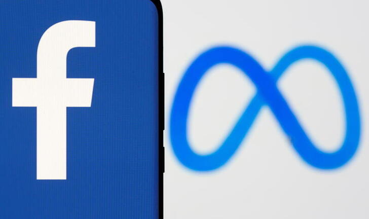 FILE PHOTO: Facebook's new rebrand logo Meta is displayed behind a smartphone with the Facebook logo in this illustration picture taken October 28, 2021. REUTERS/Dado Ruvic/Illustration/File Photo