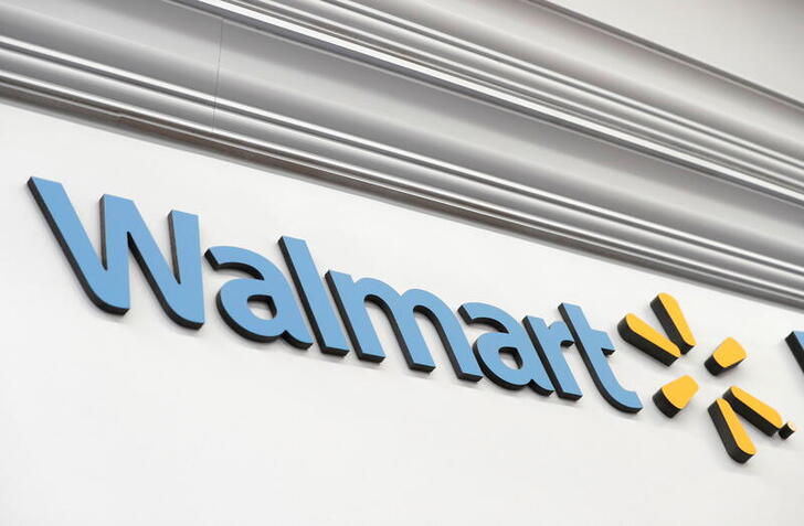A Walmart sign is seen inside its department store where the Moderna coronavirus disease (COVID-19) vaccine is available as Walmart and other major U.S. pharmacies take part in the Federal Retail Pharmacy Program, to increase vaccinations in the U.S. in West Haven, Connecticut, U.S., February 17, 2021. REUTERS/Mike Segar