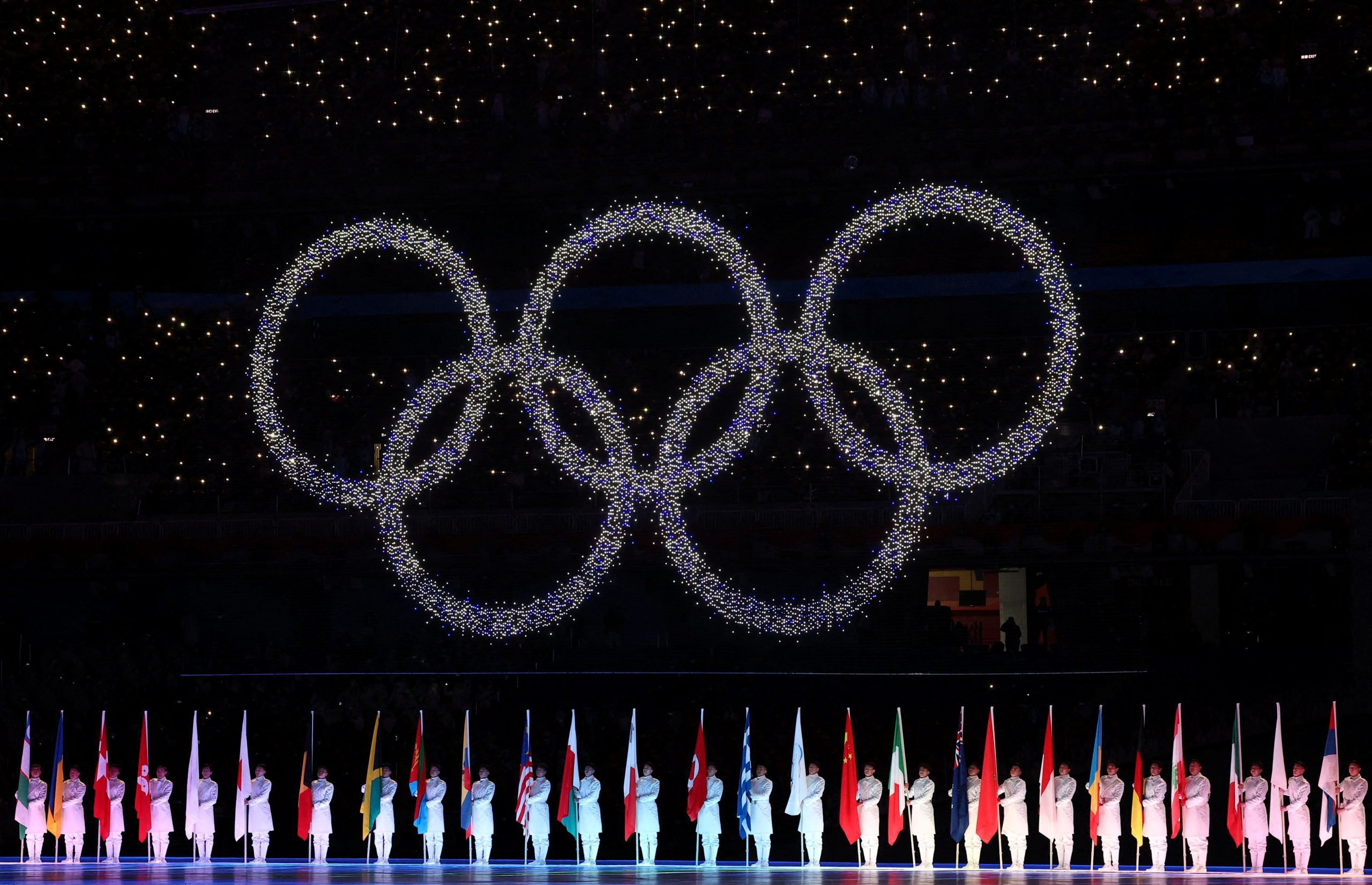 Performers and The Olympic Rings are seen during the closing ceremony. REUTERS/Kim Hong-Ji