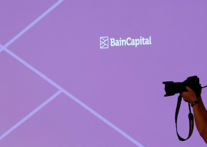 The logo of Bain Capital is displayed on the screen during a news conference in Tokyo, Japan October 5, 2017. REUTERS/Kim Kyung-Hoon