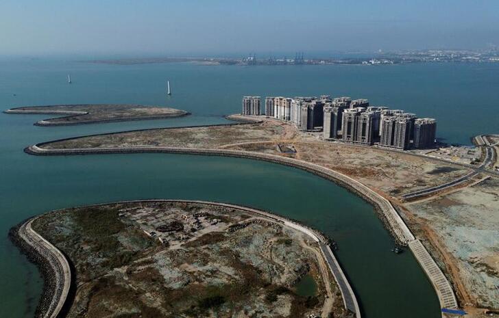 FILE PHOTO: An aerial view shows the 39 buildings developed by China Evergrande Group that authorities have issued demolition order on, on the manmade Ocean Flower Island in Danzhou, Hainan province, China January 6, 2022. Picture taken with a drone. REUTERS/Aly Song/File Photo