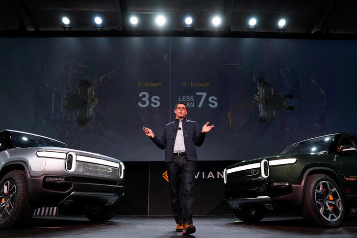 FILE PHOTO: R.J. Scaringe, Rivian's 35-year-old CEO, introduces his company's R1T all-electric pickup truck and all-electric R1S SUV at Los Angeles Auto Show in Los Angeles, California, U.S. November 27, 2018.  REUTERS/Mike Blake/File Photo