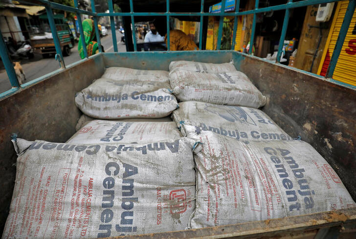 A view shows Ambuja Cement bags, to be carried to a construction site, in a load carrier in Ahmedabad, India, July 29, 2022. REUTERS/Amit Dave
