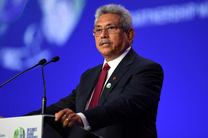 FILE PHOTO: More than eight months before an economic crisis and mass protests prompted him to flee Sri Lanka, President Gotabaya Rajapaksa presented his national statement during  the World Leaders' Summit at the UN Climate Change Conference (COP26) in Glasgow, Scotland, Britain November 1, 2021. Andy Buchanan/Pool via REUTERS/File Photo