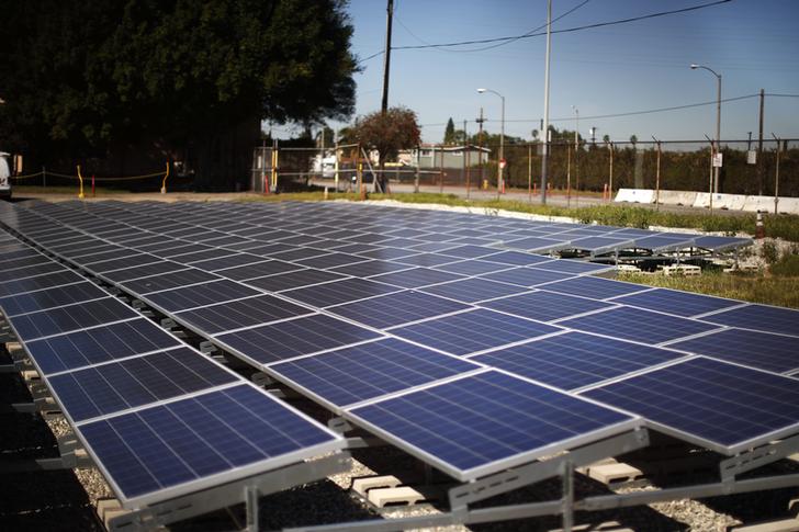 Solar panels are seen next to a Southern California Edison electricity station in Carson, California March 4, 2015. REUTERS/Lucy Nicholson (UNITED STATES - Tags: ENERGY ENVIRONMENT BUSINESS)