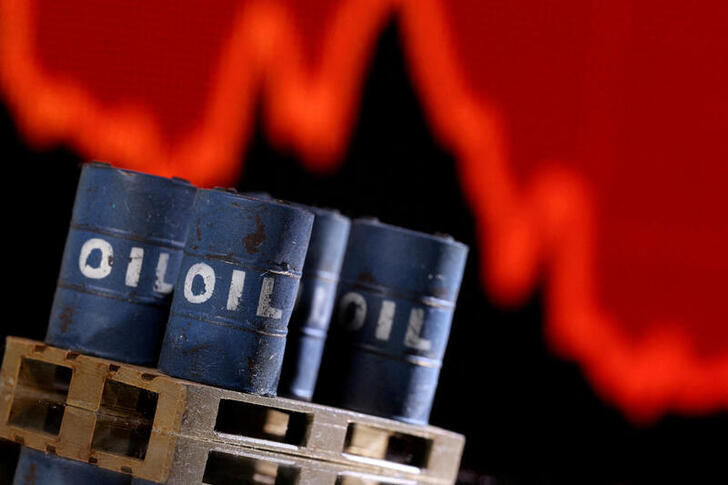 FILE PHOTO: A model of 3D printed oil barrels is seen in front of displayed stock graph going down in this illustration taken, December 1, 2021. REUTERS/Dado Ruvic/Illustration/File Photo