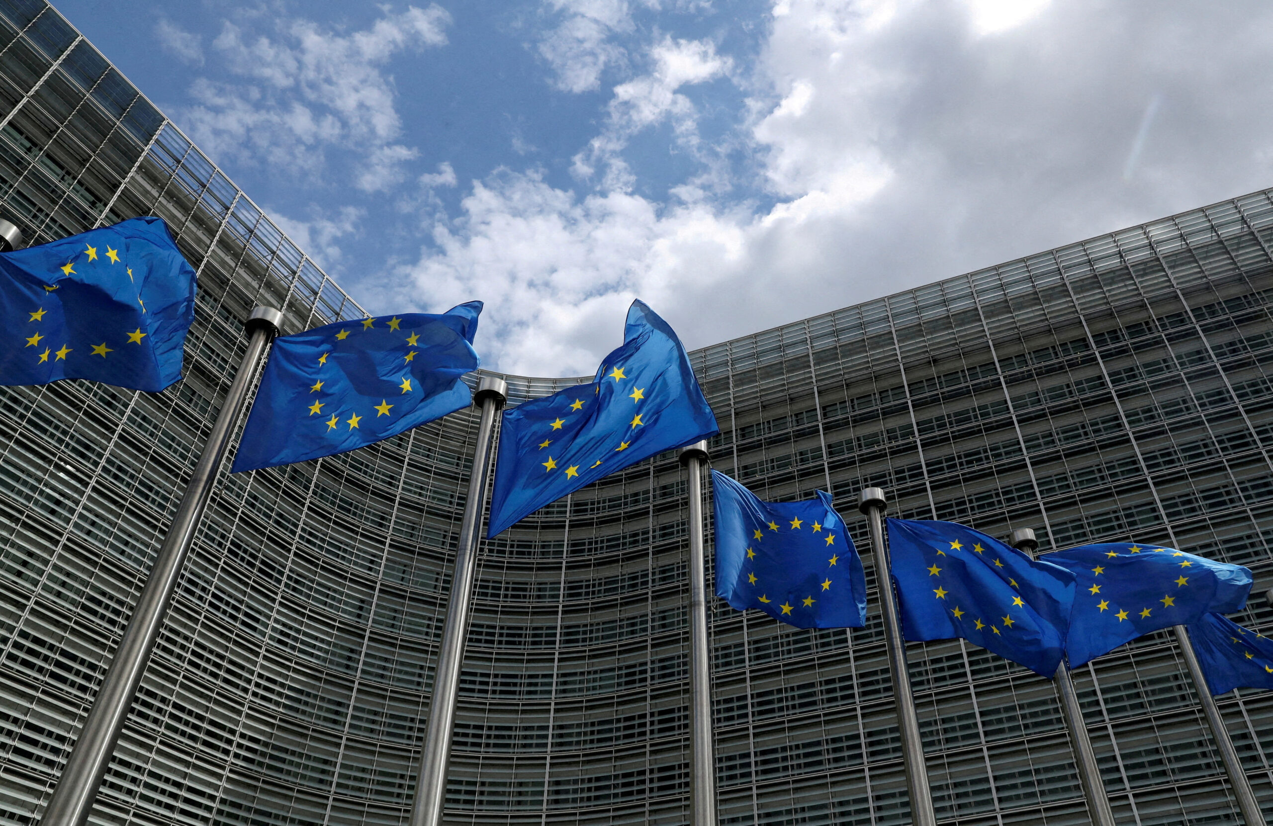 FILE PHOTO: European Union flags flutter outside the European Commission headquarters in Brussels, Belgium, June 5, 2020.  REUTERS/Yves Herman/File Photo