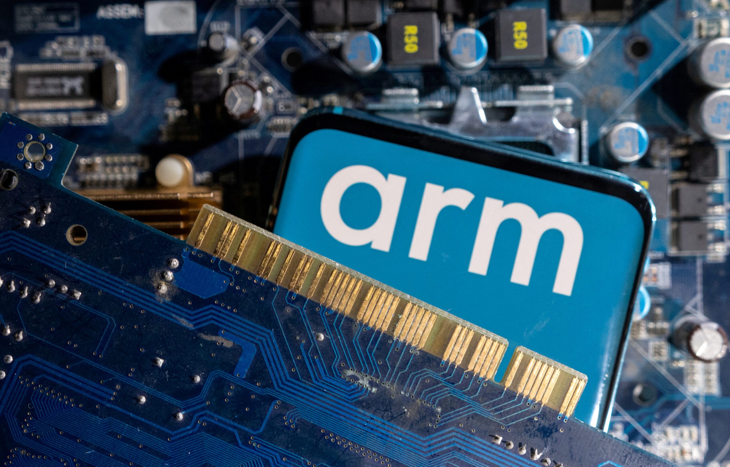 FILE PHOTO: A smartphone with a displayed Arm Ltd logo is placed on a computer motherboard in this illustration taken March 6, 2023. REUTERS/Dado Ruvic/Illustration/File Photo