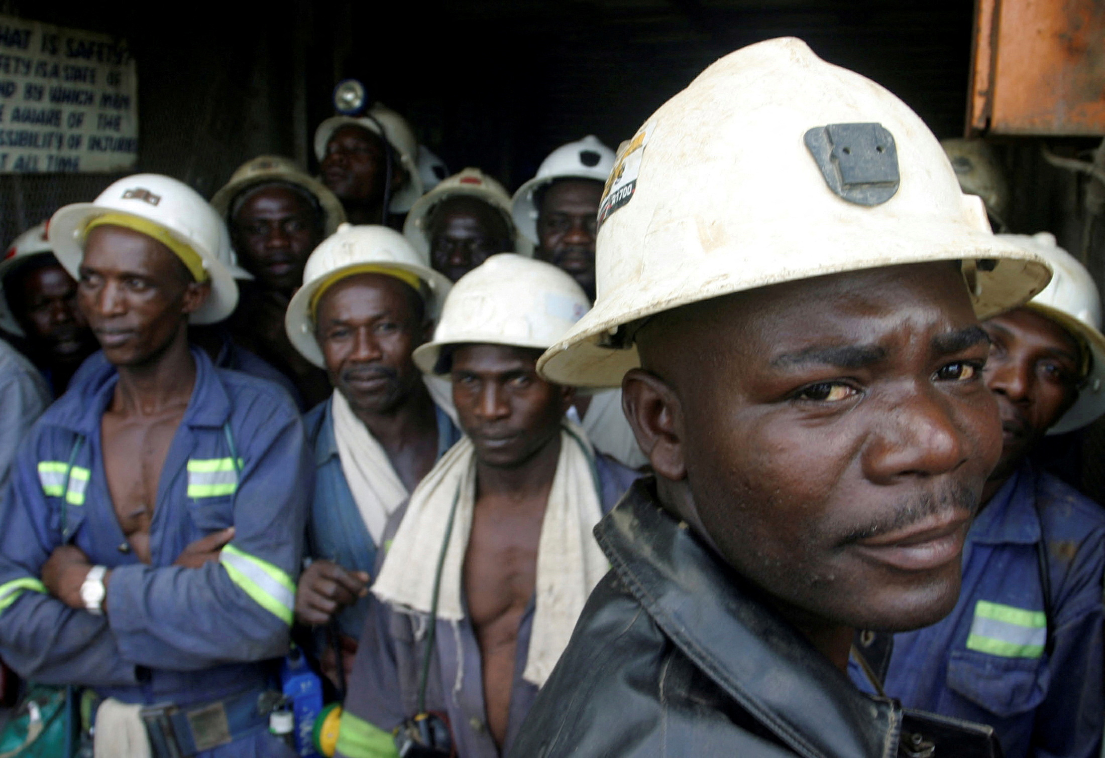 FILE PHOTO: Konkola Copper Mines PLC workers wait in a lift before going to work underground in Konkola, April 12, 2005. REUTERS/Stringer/File Photo