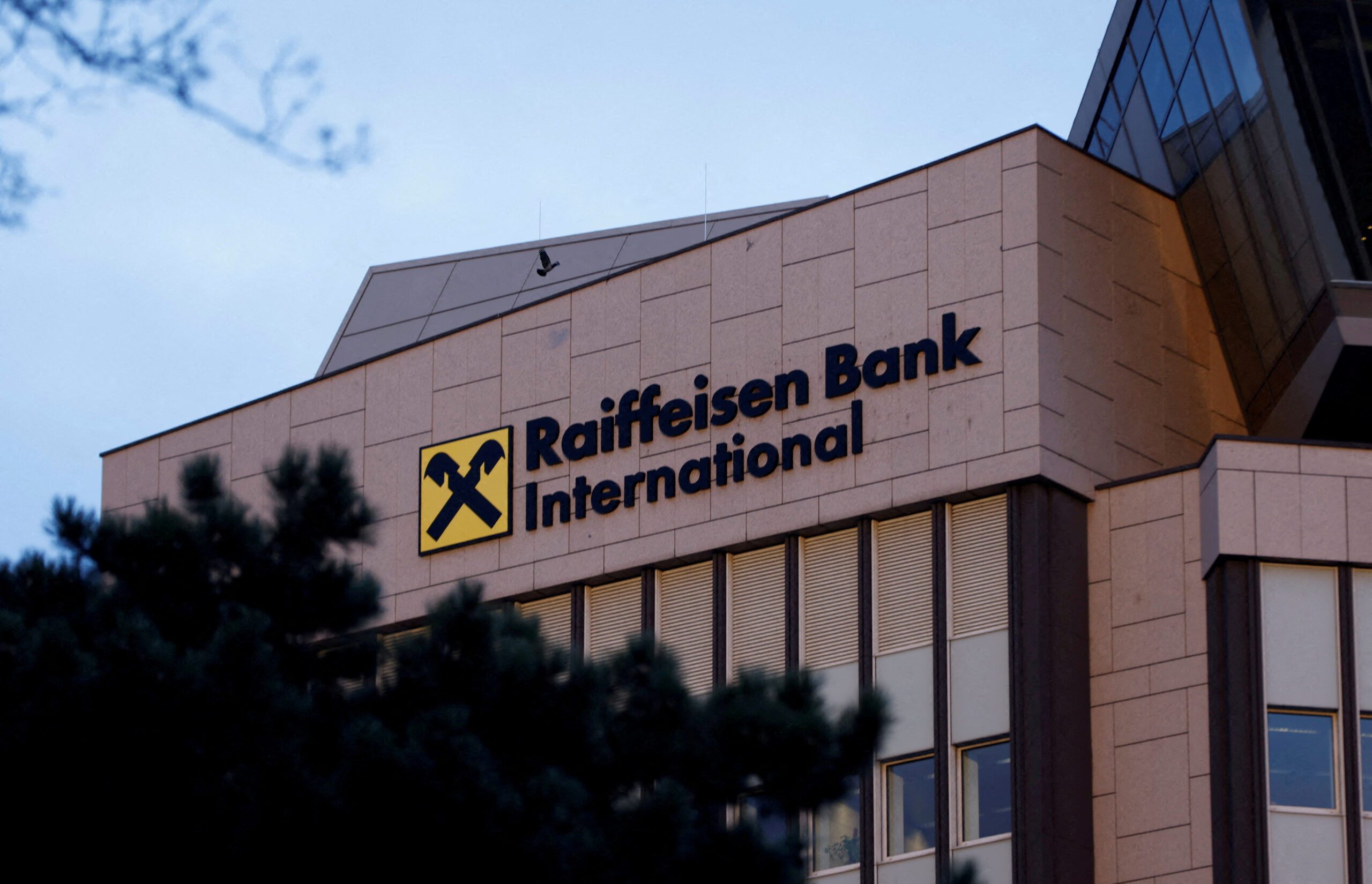 FILE PHOTO: The logo of Raiffeisen Bank International (RBI) is seen on their headquarters in Vienna, Austria, March 14, 2023. REUTERS/Leonhard Foeger/File Photo